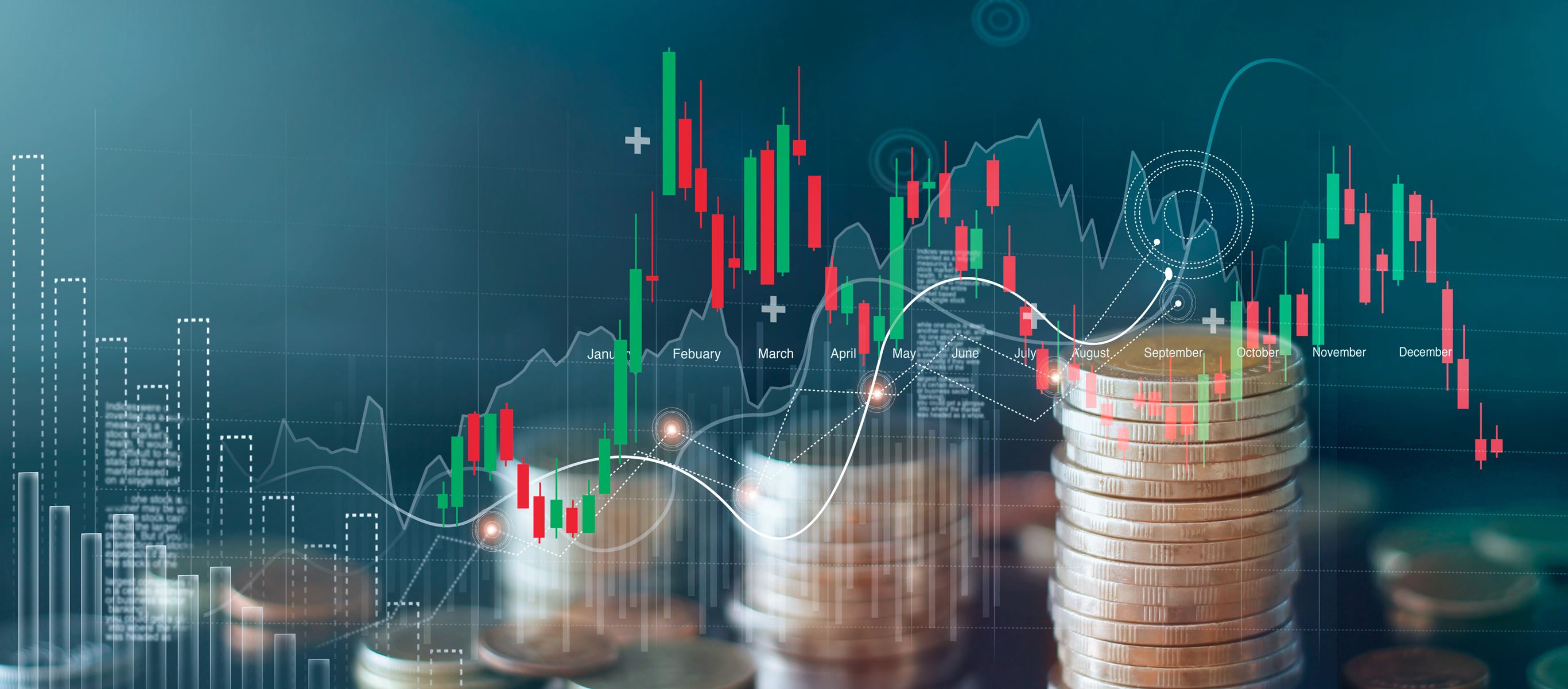 Stacked coins behind a computer generated graph